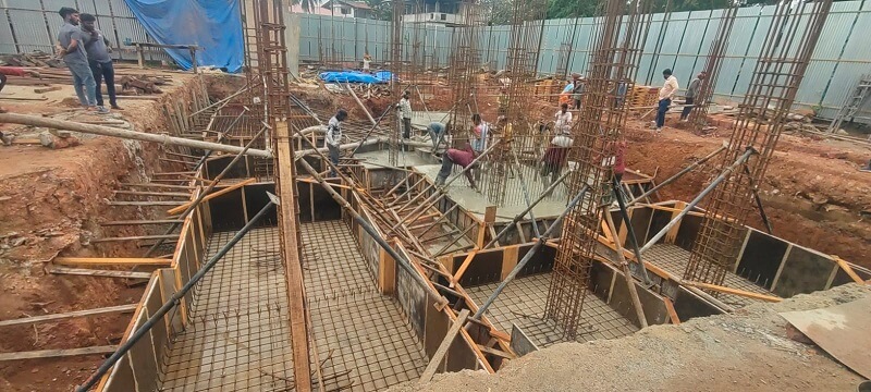 Cement is poured into the dugged pits.