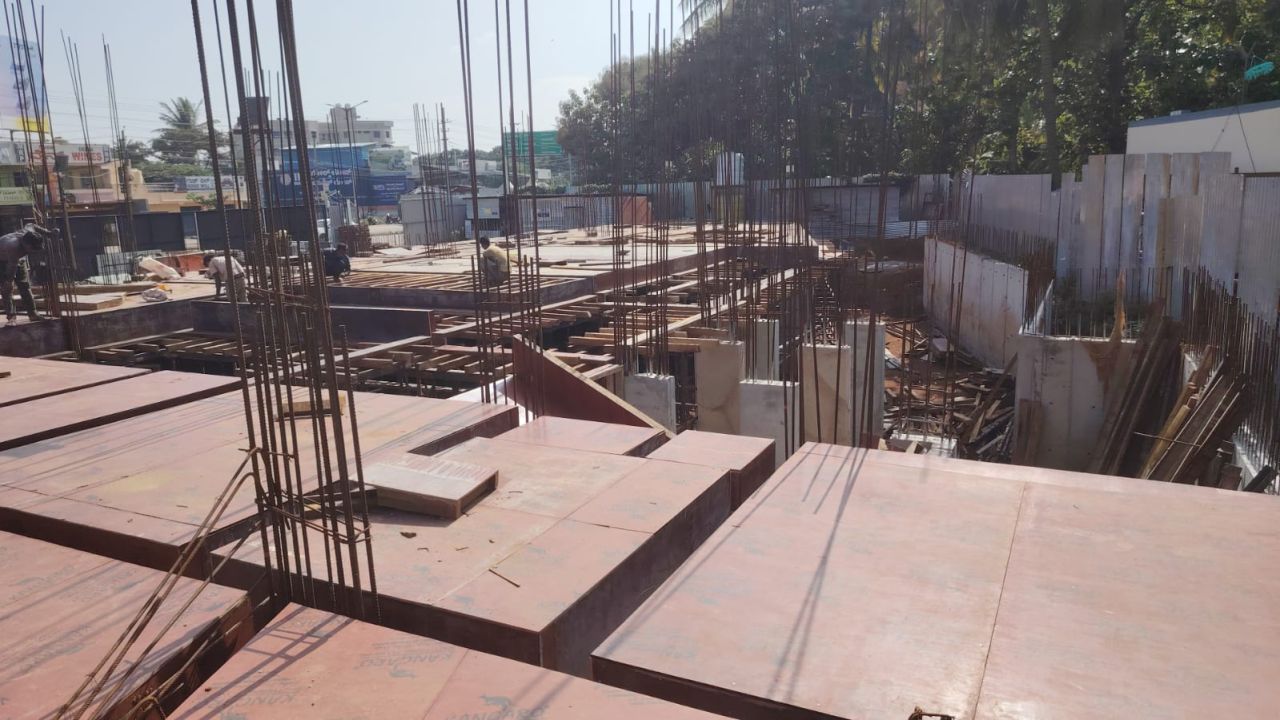 Inland Tiara first slab pour 2 shuttering work with plywood formwork and column reinforcement in progress.